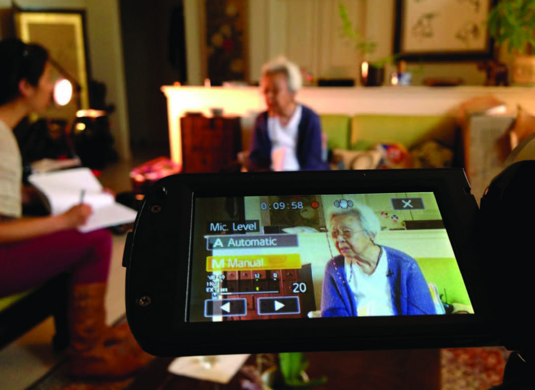 Filmed oral history taking place in interview subject's home