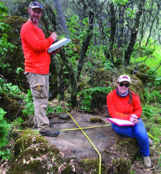 Scott McGaughey and Sam Dollinger record bedrock mortar