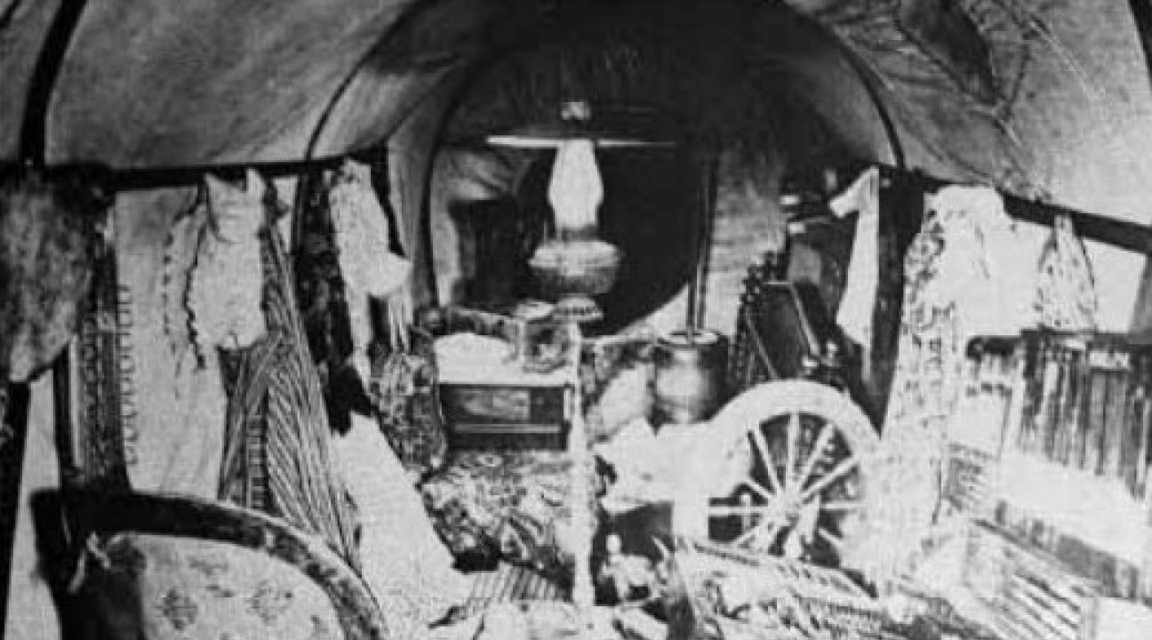 alt="An overloaded wagon brought across the plains"